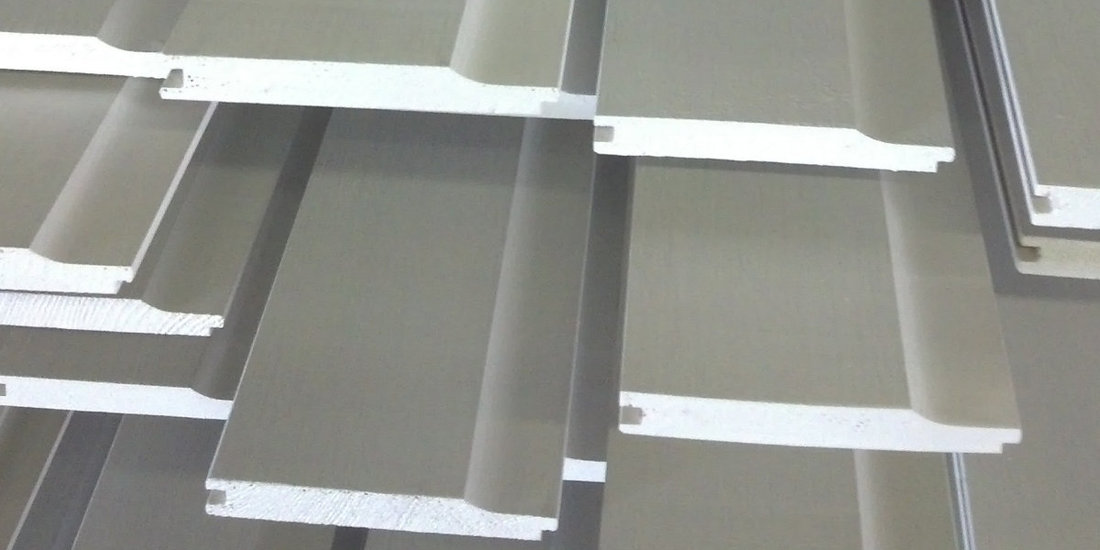 TONGUE & GROOVE PATTERN #106 WITH DUTCH LAP PROFILE  CLEAR CEDAR FJ GRADE JUST PAINTED, DRYING ON RACKS