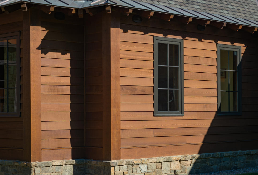 INSTALLATION INCLUDES OVERHANG TO HANDLE DRAINAGE, STONE VENEER FOR SPLASH BACK, RAINSCREEN PROVIDING AIR SPACE AND FACTORY PRE-FINISH