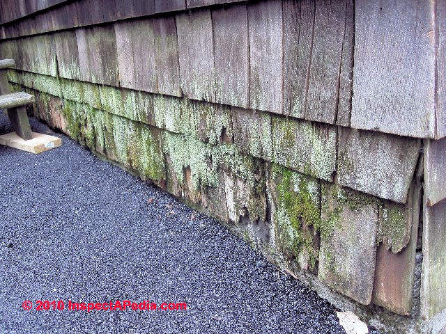 example of water splash back wood siding damage