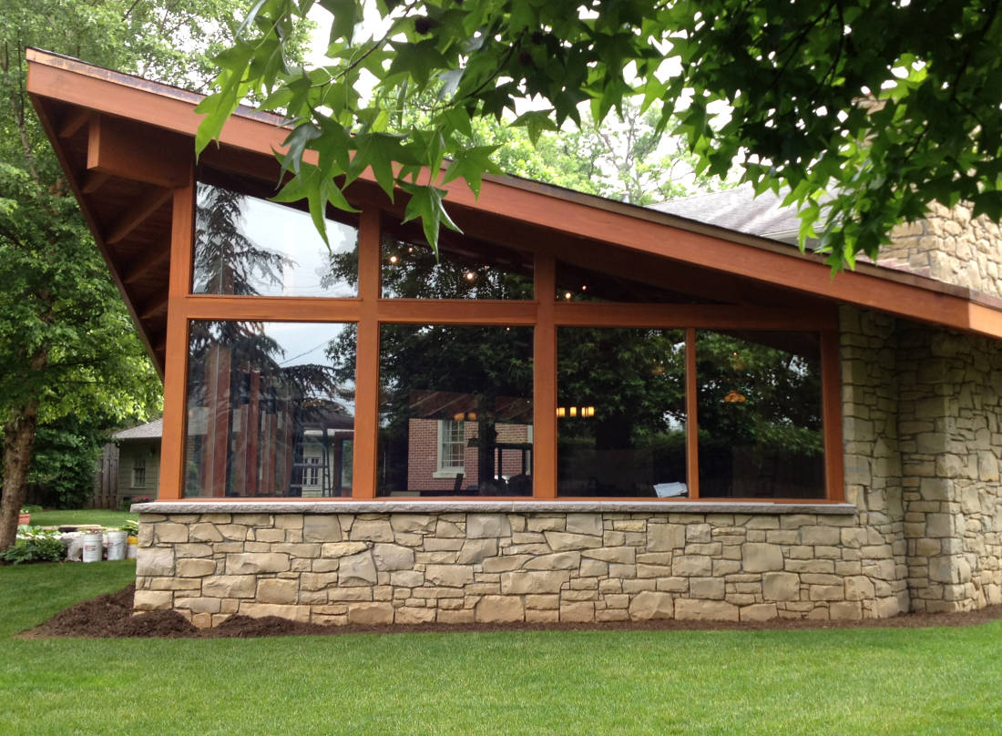 STONE VENEER INSTALLATION PROTECTS AGAINST WATER SPLASH BACK