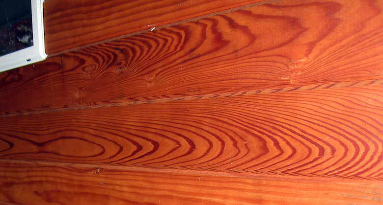 redwood siding CAH flat grain stained