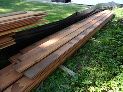 water puddles on redwood or cedar drawing natural tannins to the surface 